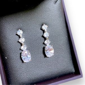 Silver and white diamond earrings.